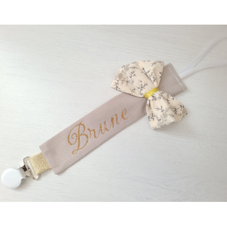 Attache tétine personnalisée beige et or, noeud fleuri